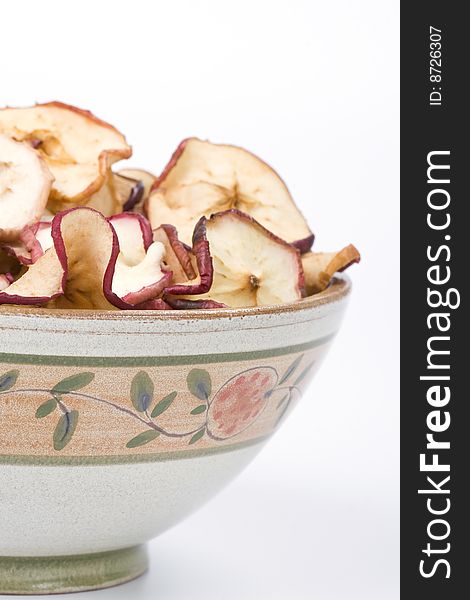 Dried apples in a ceramic bowl