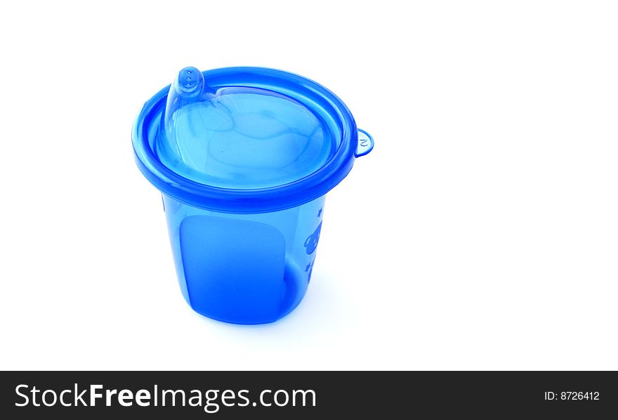 A blue plastic sipping cup on a white background. A blue plastic sipping cup on a white background