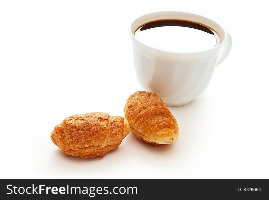 Cup of coffee and croissants on white background. Cup of coffee and croissants on white background