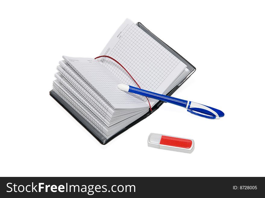 Pen, notebook and USB flash drive isolated on the white background