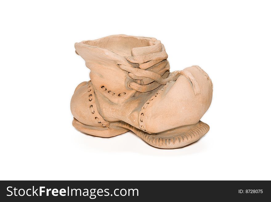 Brown clay boot isolated on the white background