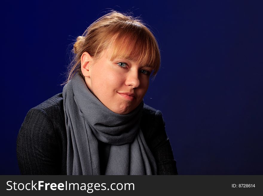 Portrait of female on a blue background in studio