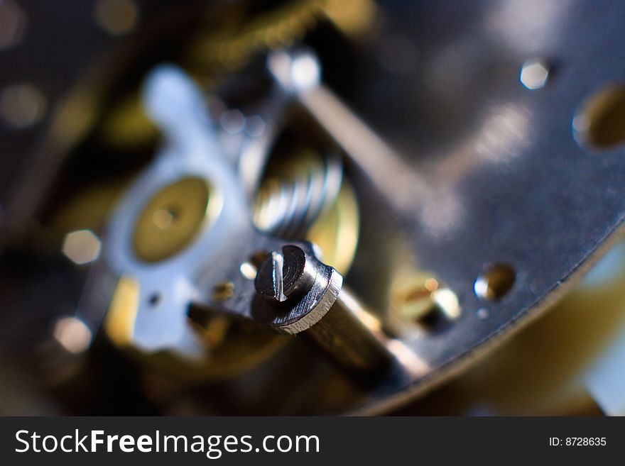 Cogs and wheels from the inside of an clock. Macro - low DOF.