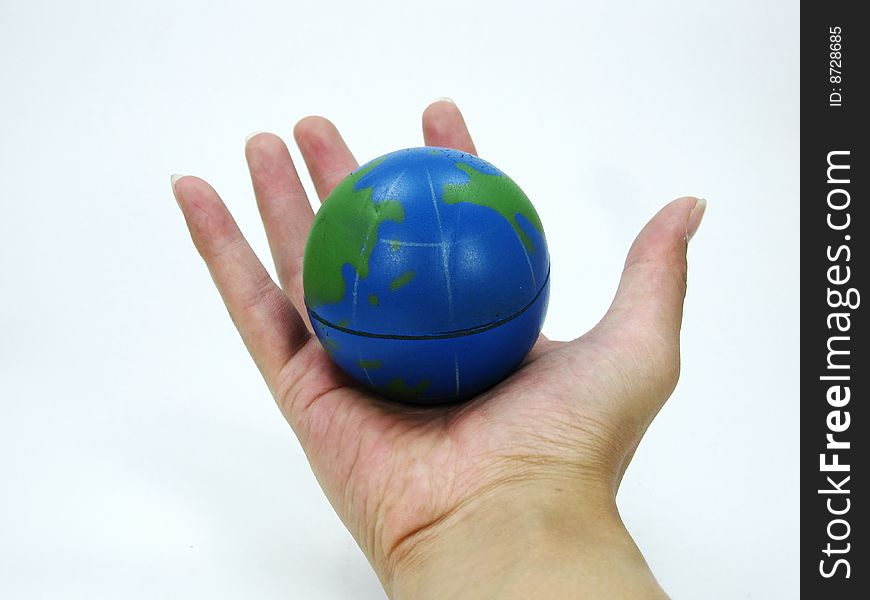 Toy earth in the palm of the hand. Toy earth in the palm of the hand