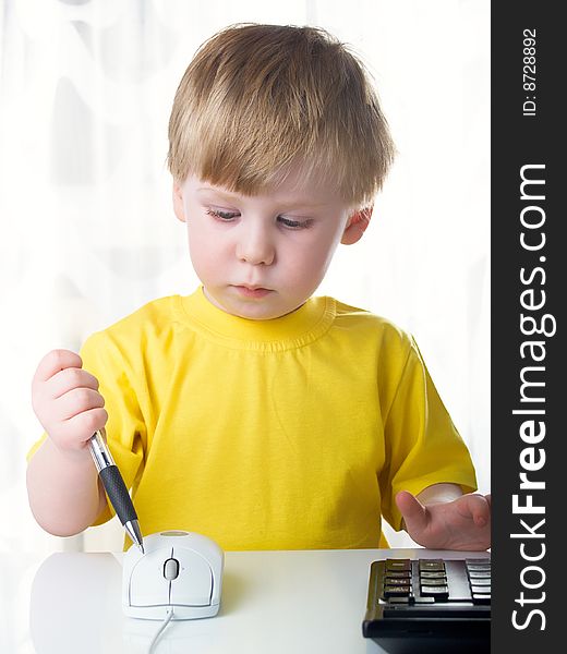 Little boy using a mouse on white background. Little boy using a mouse on white background