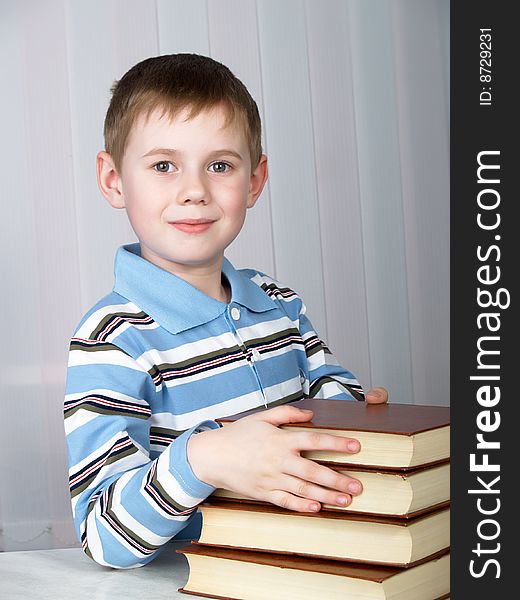 The child with books on the white