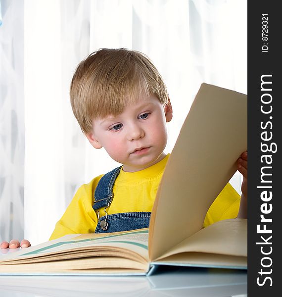 The child with books on the white background