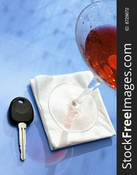 Drunk driving concept glass of alcohol and car key. Drunk driving concept glass of alcohol and car key