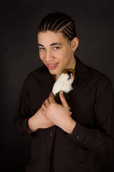 Aruban Sexy Male Is Holding A Guinea Pig Royalty Free Stock Photos