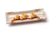 Eggs Yolk Roasted On Skewer With Sauce Stock Images
