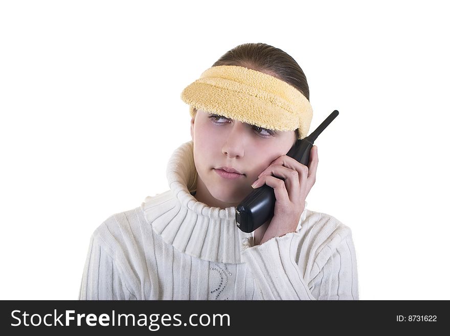Teenage girl on the phone wearing yellow hat,isolated over white background