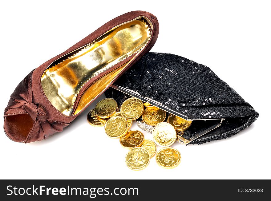 Ladies footwear and purse with coins on white background