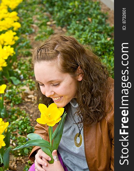 Pretty Girl smelling flower