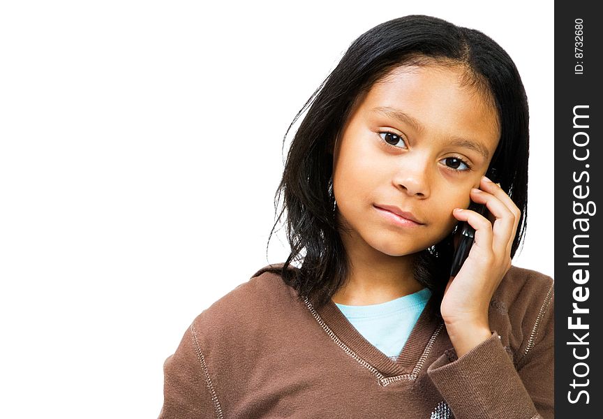 Girl talking on a mobile phone isolated over white. Girl talking on a mobile phone isolated over white