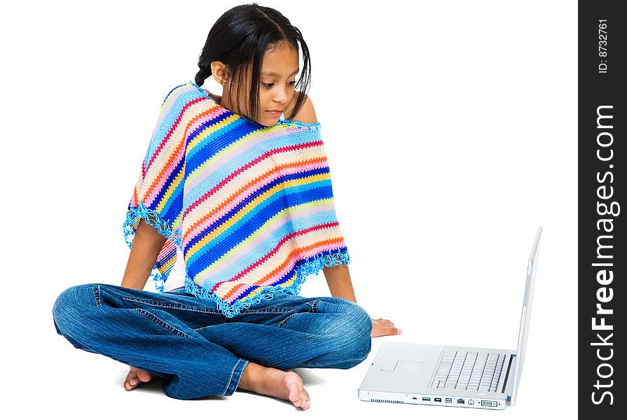 Girl sitting near a laptop isolated over white