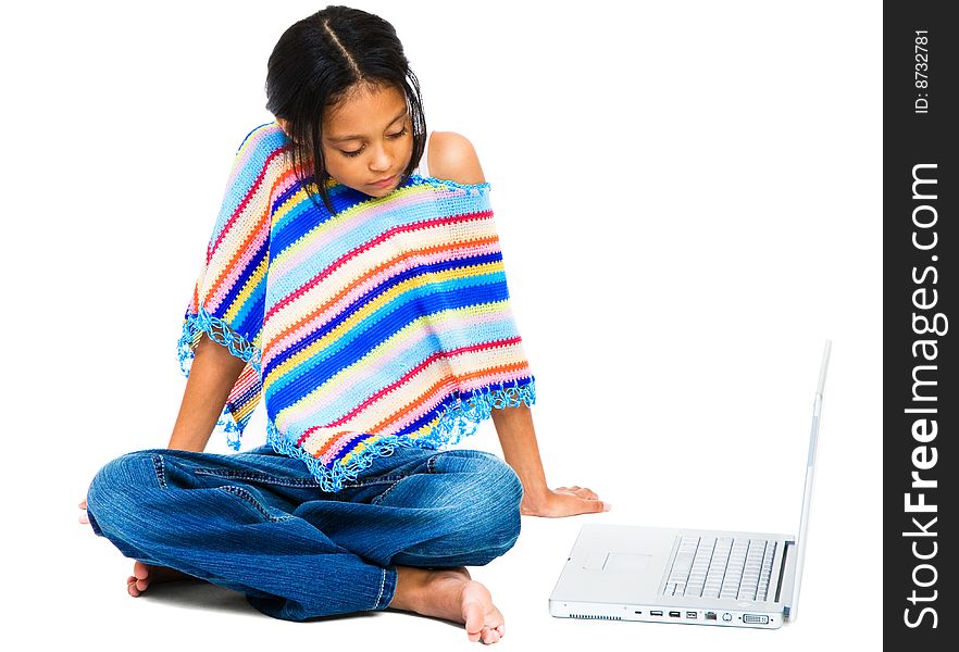 Latin American and Hispanic girl sitting near a laptop isolated over white. Latin American and Hispanic girl sitting near a laptop isolated over white