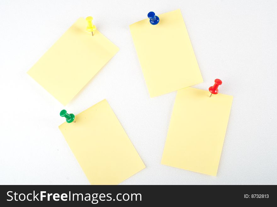 Yellow post it note with color pin isolated. Yellow post it note with color pin isolated