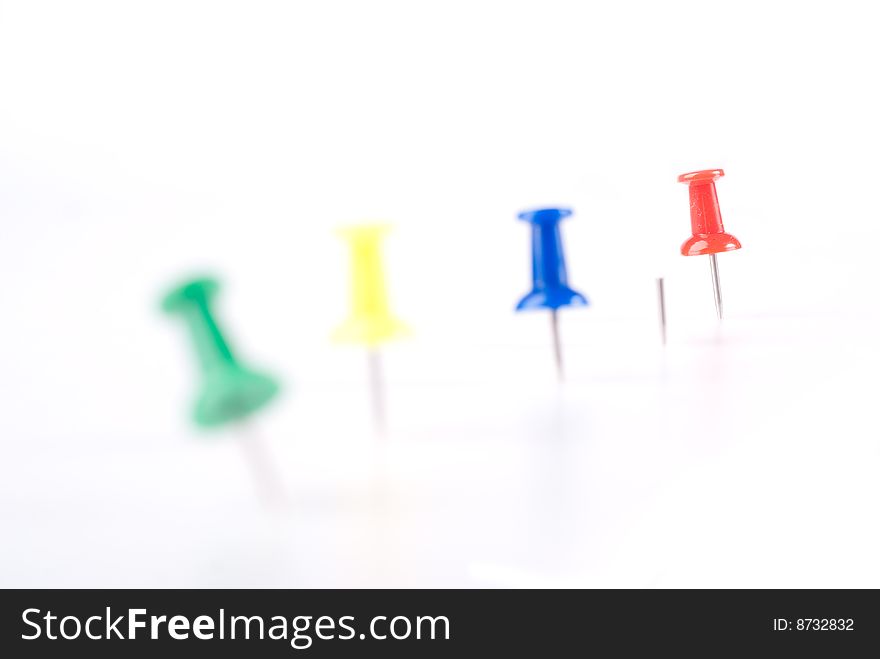 Colorful office pin with red standing out. Colorful office pin with red standing out