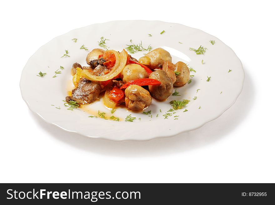 Savory mushrooms with pieces of onion, tomatoes and dill in white plate over white background