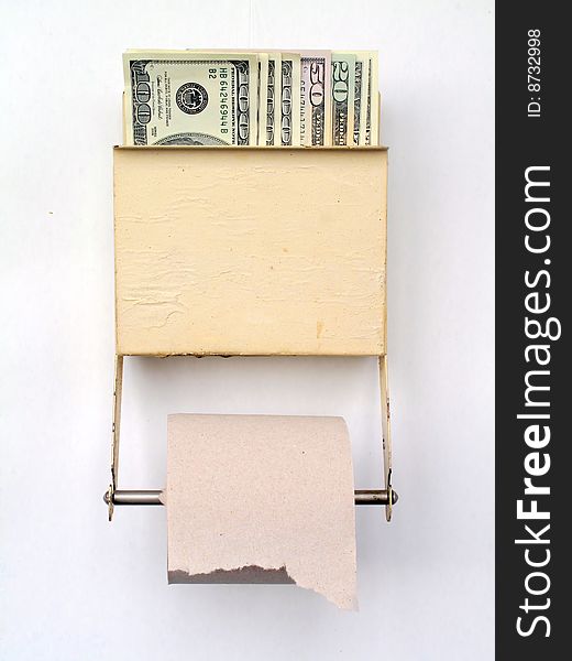 US dollars held in a tiolet paper dispenser. US dollars held in a tiolet paper dispenser