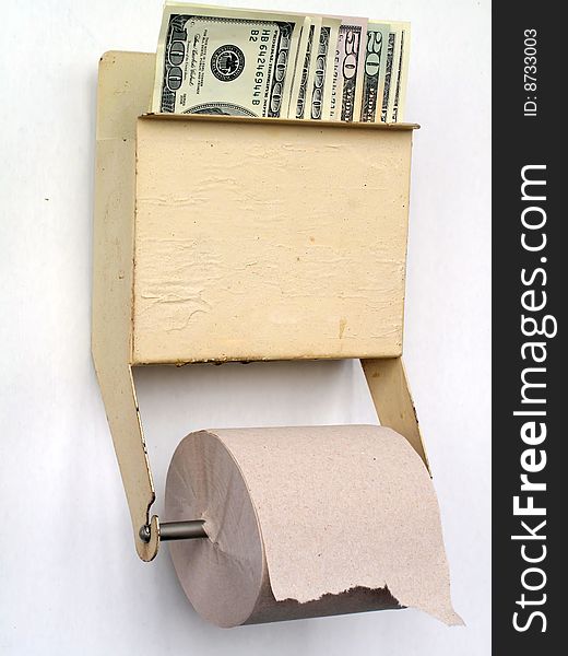 US dollars held in a tiolet paper dispenser. US dollars held in a tiolet paper dispenser