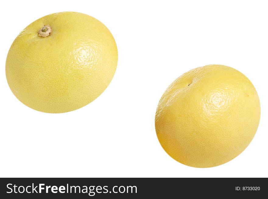 Two tasty grapefruits isolated on a white background. Two tasty grapefruits isolated on a white background.