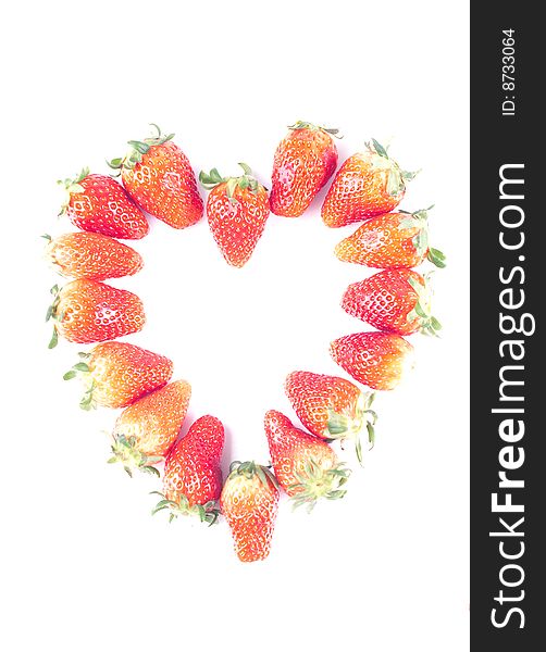 Fresh juicy strawberry isolated on white with heart shape