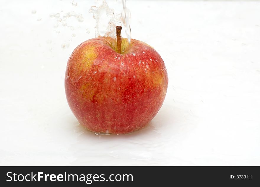 Fresh,cool  splash of water on an apple. Fresh,cool  splash of water on an apple.