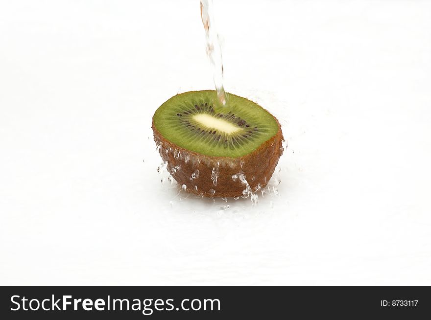 Half of shaggy kiwi in streaming water. Half of shaggy kiwi in streaming water.