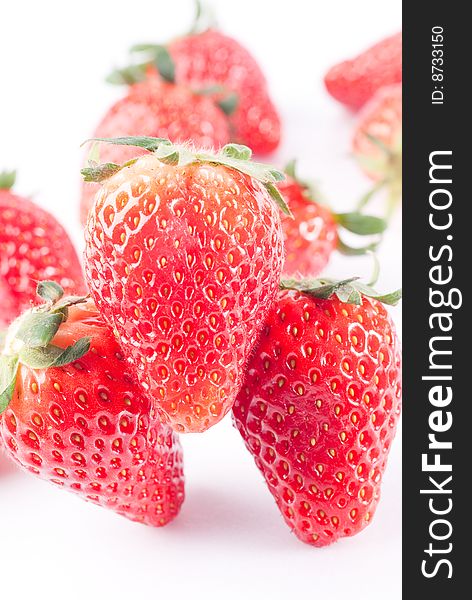 Fresh juicy standing strawberry isolated on white