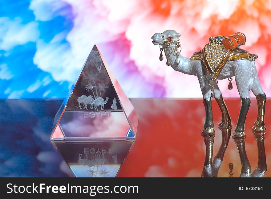 Wonderful camel and glass pyramid opposite abstract background. Wonderful camel and glass pyramid opposite abstract background.