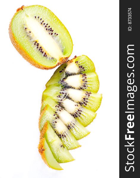 Sliced ripe fresh kiwi isolated on white. Sliced ripe fresh kiwi isolated on white