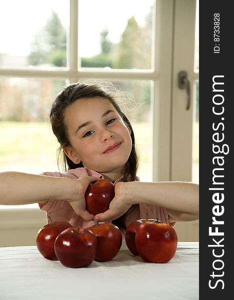 Brown Haired Child Holding An Apple