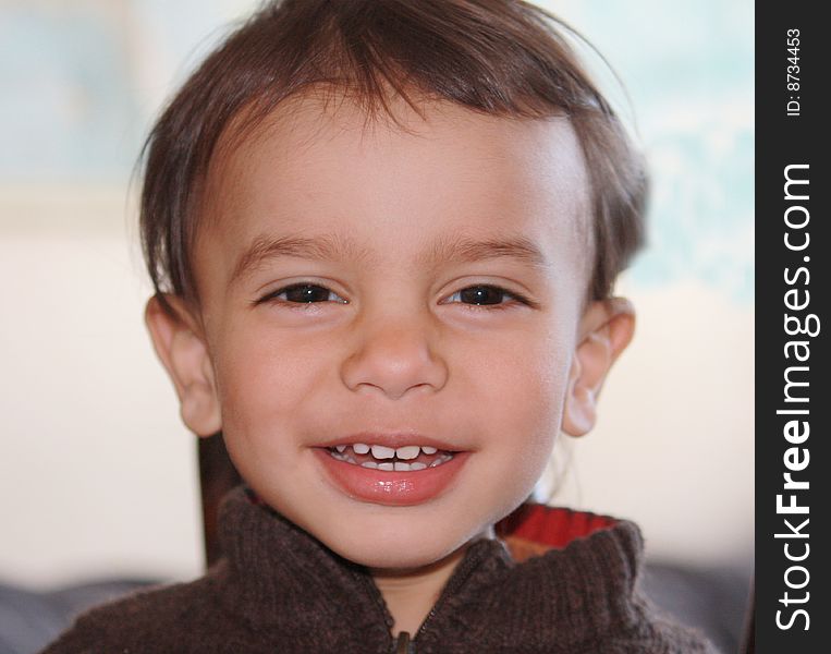 Portrait of a little boy smiling into the camera