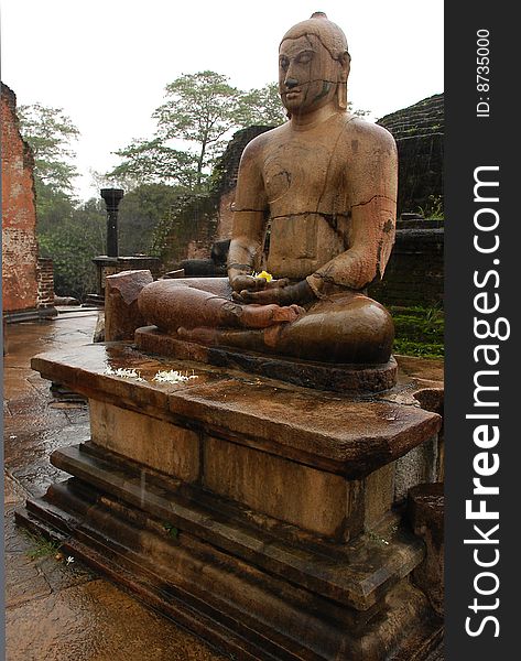 Four seated Buddhas are located in the Vatadage ancient house of relic in Polonnaruwa, Sri Lanka. One of them is shown in the picture. Four seated Buddhas are located in the Vatadage ancient house of relic in Polonnaruwa, Sri Lanka. One of them is shown in the picture.