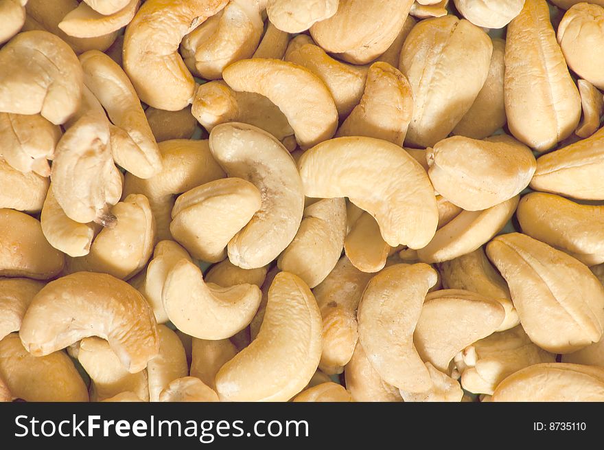 Fried cashew nuts, food background close-up