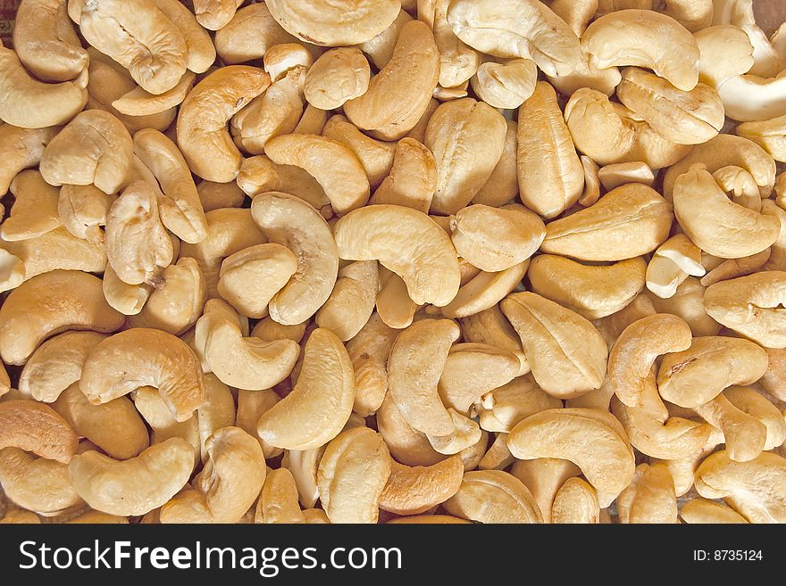 Fried cashew nuts, food background