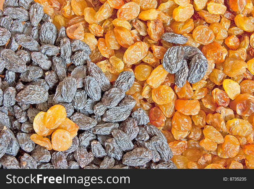 Juicy yin yang raisins, two-colour food background