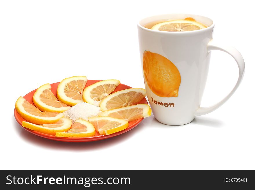 Tea in cups and lemon isolated on white background