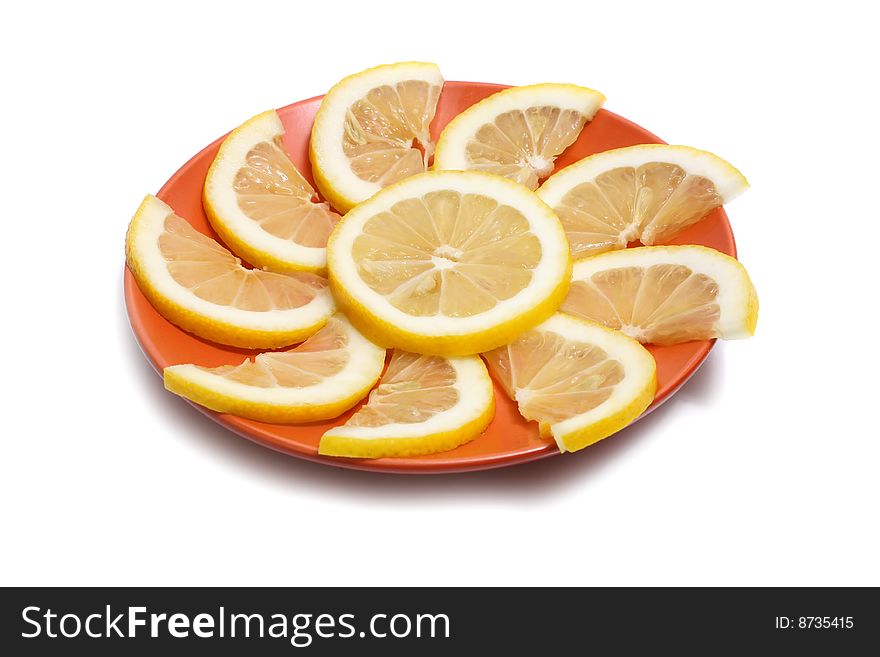 Lemon in plate isolated on white background