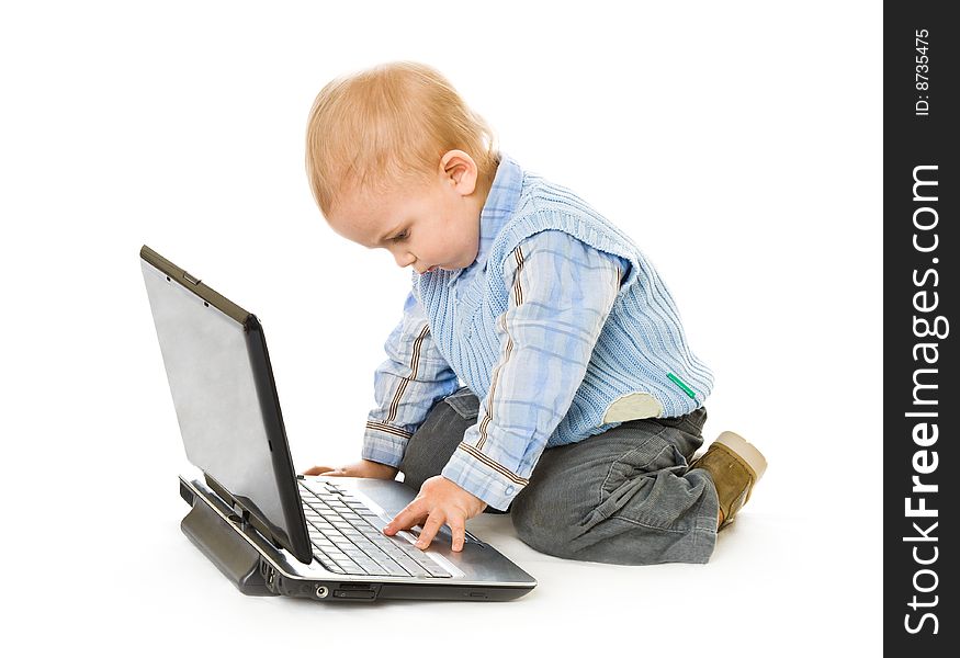 Concept of little businessman. Little child and laptop. Isolated on white background