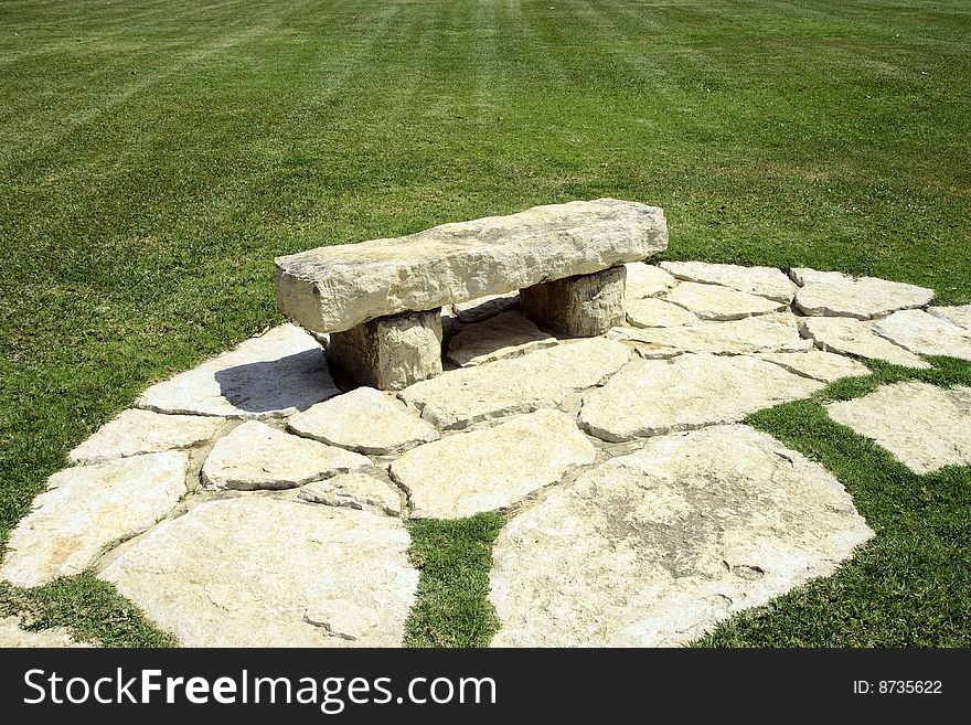 Stone laying and bench in park of the Rothschild Israel