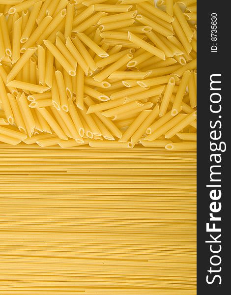 Two kinds of uncooked pasta background