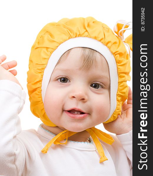 Child in yellow cap close-up face portrait isolated on white. Child in yellow cap close-up face portrait isolated on white