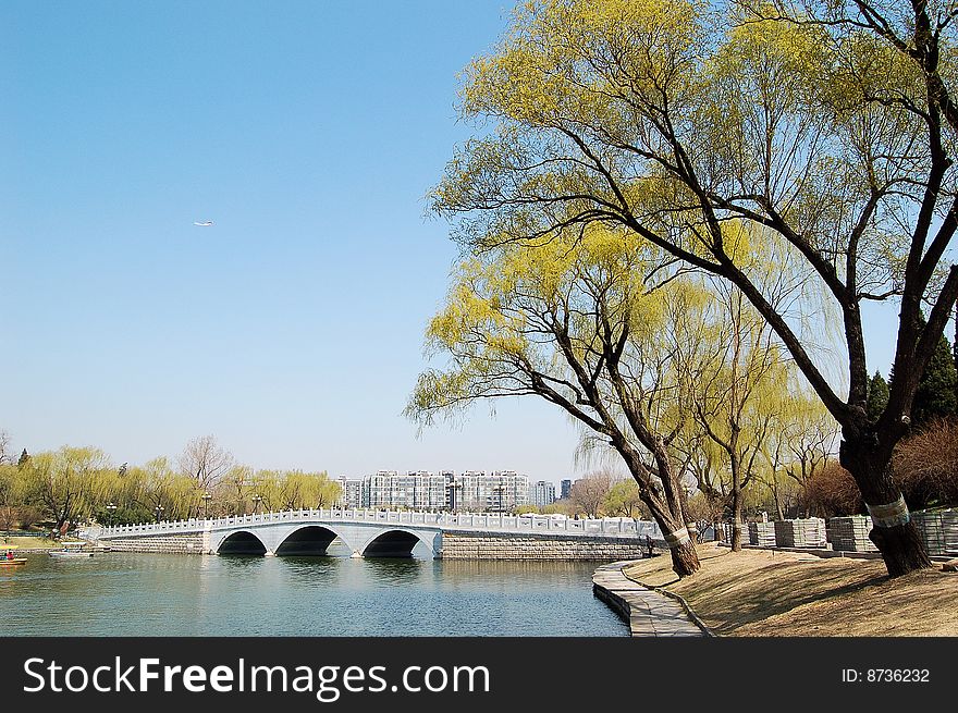 Lake with stone bridge and willows at the bank, shot at Tao ran park in spring, Beijing. Lake with stone bridge and willows at the bank, shot at Tao ran park in spring, Beijing.