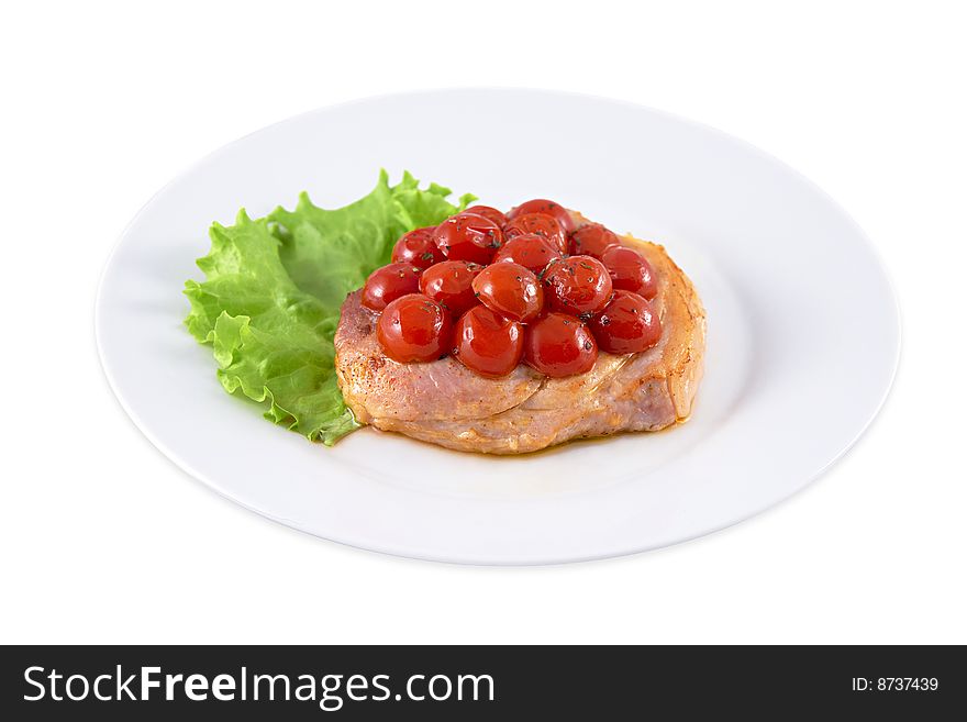 In a photo one of dishes of Russian ethnic cuisine - fried meat with tomatoes is presented.