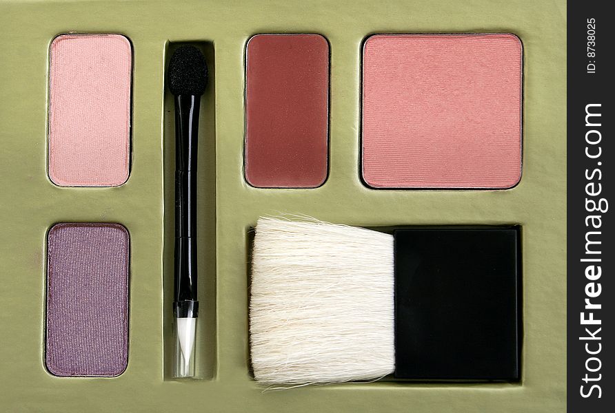 Makeup set with blush, brush and eyeshadow.