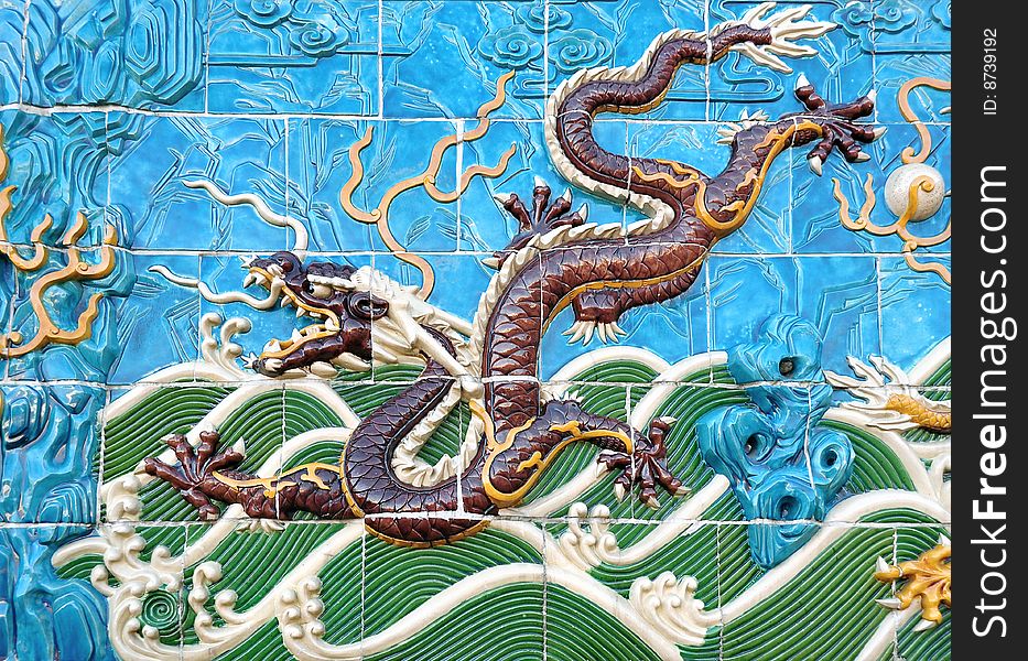 Traditional detail of a chinese ceramic dragon on the palace wall. Traditional detail of a chinese ceramic dragon on the palace wall.