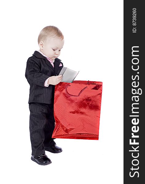 Happy kid with his present over a white background