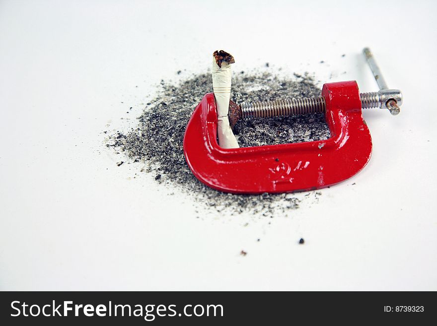 A smoke being crushed in a red vise. A smoke being crushed in a red vise